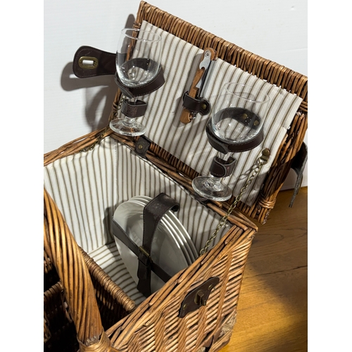 248 - A wicker picnic basket. 52x33x43cm.