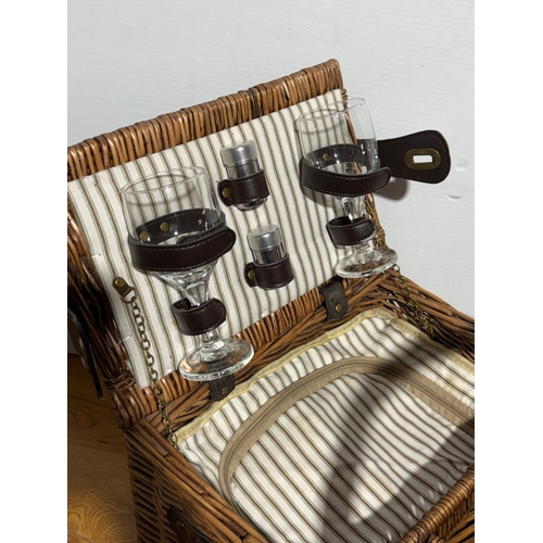 248 - A wicker picnic basket. 52x33x43cm.