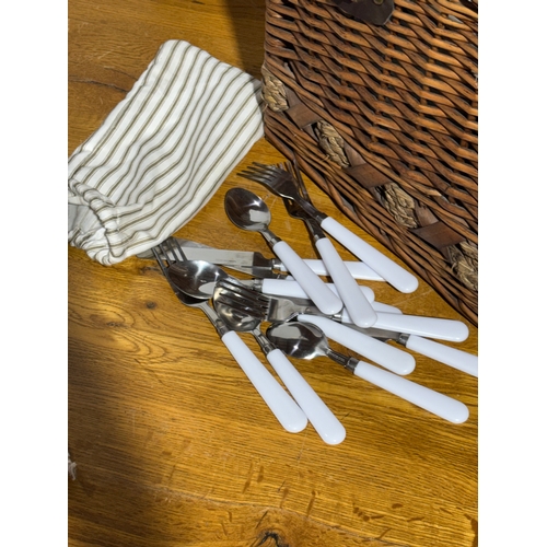 248 - A wicker picnic basket. 52x33x43cm.