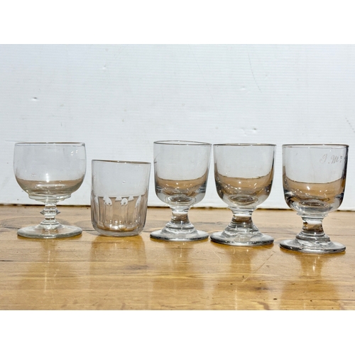 81 - Georgian and Victorian drinking glasses. An Irish Georgian rummer 9x12cm. A set of three Victorian r... 