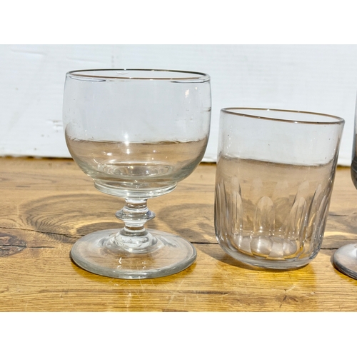 81 - Georgian and Victorian drinking glasses. An Irish Georgian rummer 9x12cm. A set of three Victorian r... 