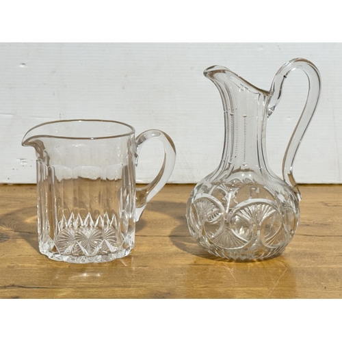 252 - Two Victorian glass jugs. 24.5cm. 19x12.5x16cm.