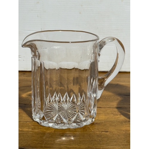 252 - Two Victorian glass jugs. 24.5cm. 19x12.5x16cm.