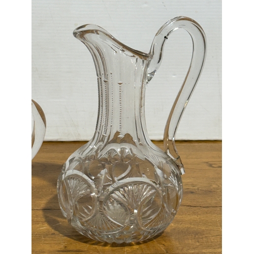 252 - Two Victorian glass jugs. 24.5cm. 19x12.5x16cm.