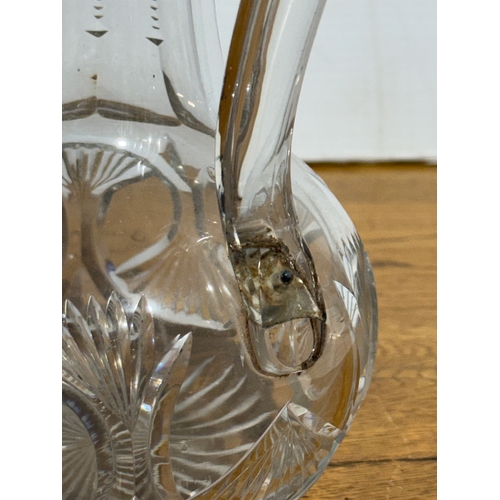 252 - Two Victorian glass jugs. 24.5cm. 19x12.5x16cm.