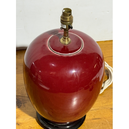 83 - A Chinese Sang de Boeuf table lamp. 22x43cm.