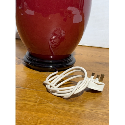83 - A Chinese Sang de Boeuf table lamp. 22x43cm.