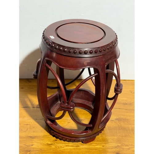 255 - A Chinese rosewood barrel form stool 40x49cm.
