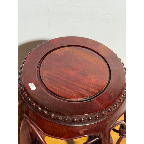 255 - A Chinese rosewood barrel form stool 40x49cm.