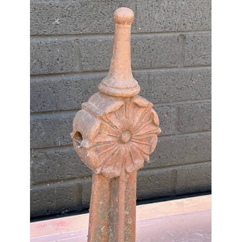 88 - Three early 20th century cast iron fence bollards. 50cm.