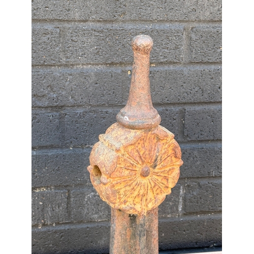 88 - Three early 20th century cast iron fence bollards. 50cm.