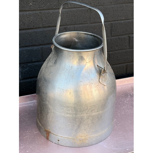 363 - A pair of vintage stainless steel milk churns.