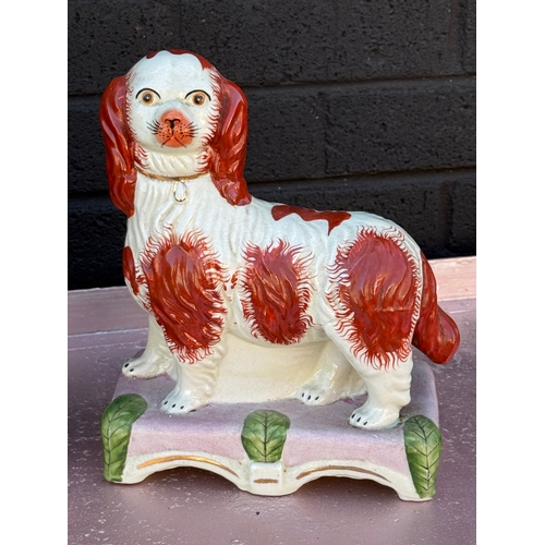103 - A pair of vintage Victorian style Staffordshire Majesty and Grace figures.