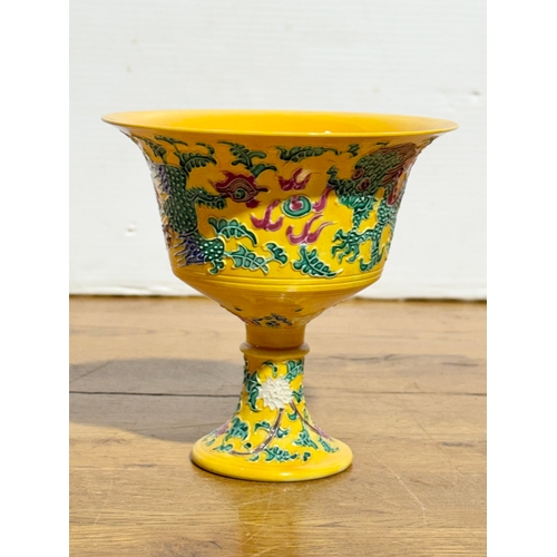 366 - A Chinese yellow-ground cup. 14.3x14.3cm