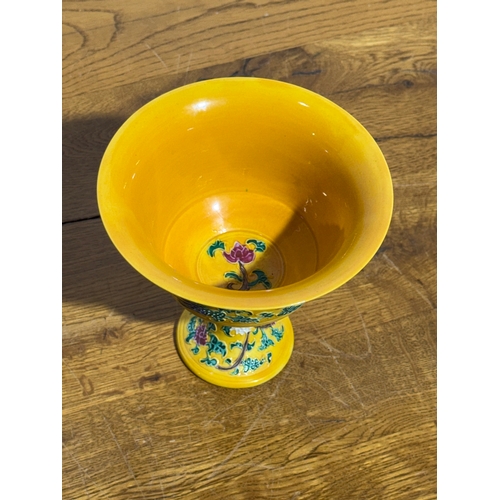 366 - A Chinese yellow-ground cup. 14.3x14.3cm