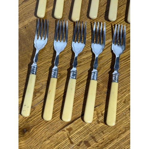 413 - A silver mounted cutlery set.