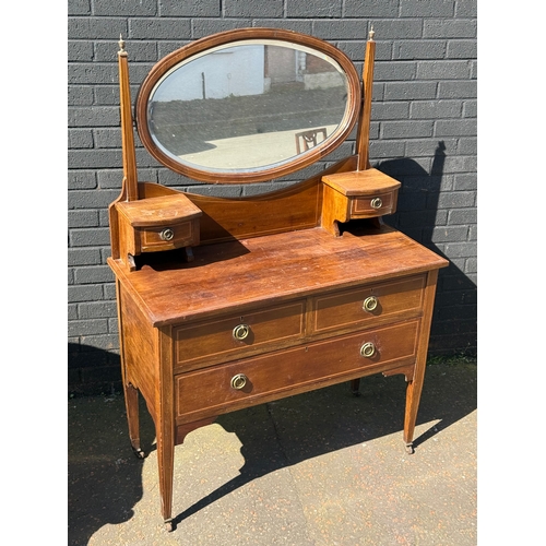 376 - An Edwardian inlaid mahogany dressing chest. 106x47x153cm.