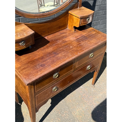 376 - An Edwardian inlaid mahogany dressing chest. 106x47x153cm.