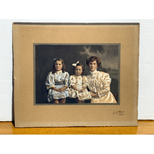 380 - An Edwardian hand tinted photograph. 30.5x25.5cm.