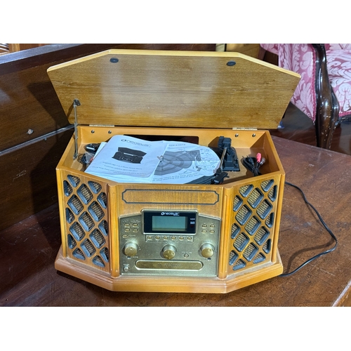 384 - A Neostar radio record player.