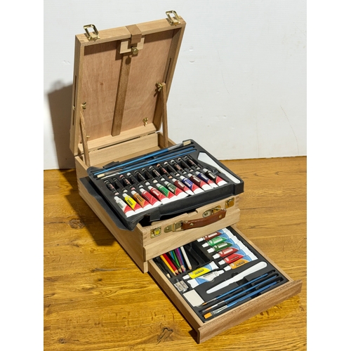 105 - An artist easel box set.