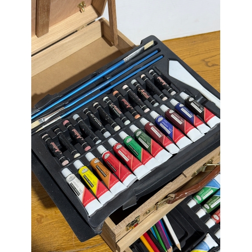 105 - An artist easel box set.