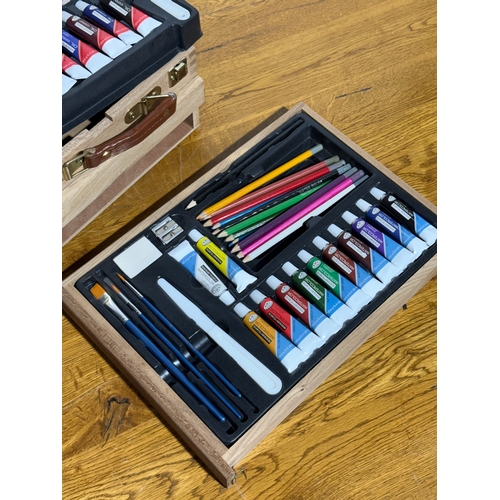 105 - An artist easel box set.