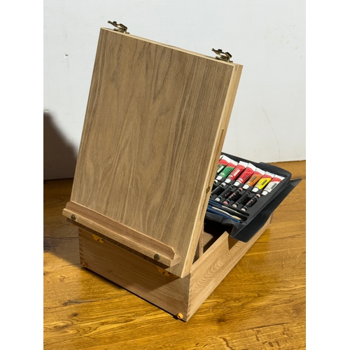 105 - An artist easel box set.