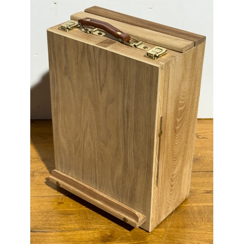 105 - An artist easel box set.