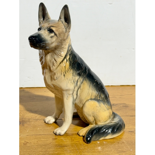 385 - A large Beswick German Shepherd. Model 2410. 23x35cm.