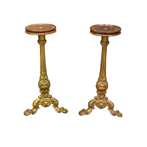 99 - A pair of Victorian gilded cast iron pedestal tables with mahogany tops. 36x70.5cm.