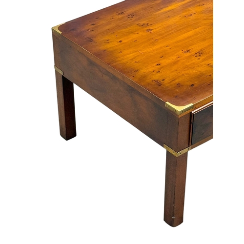 257 - A Campaign Style Yew Wood Coffee Table. With three drawers and three faux drawers. 122x56x41cm.