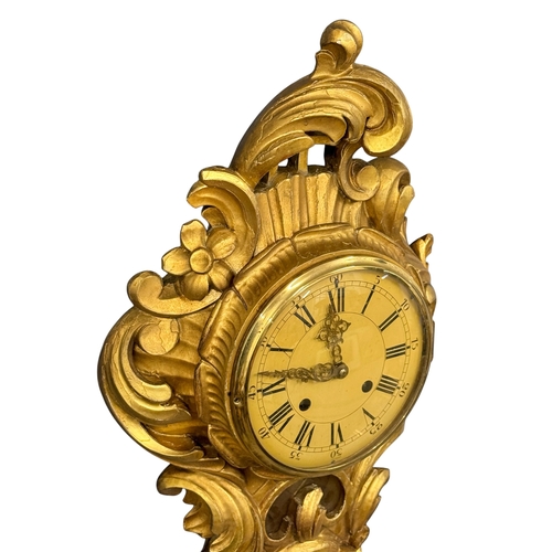 218 - A German Giltwood Rococo Style Wall Clock. Early 20th Century. 30x55cm.