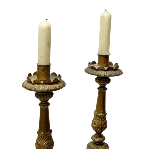 238 - A Pair of Tall Italian Giltwood Candlesticks. Early 19th Century. 66.5cm.