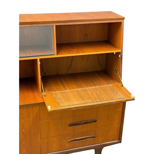 188 - Jentique, C.1960. A Teak Cocktail Sideboard. 138x42x128cm. 5