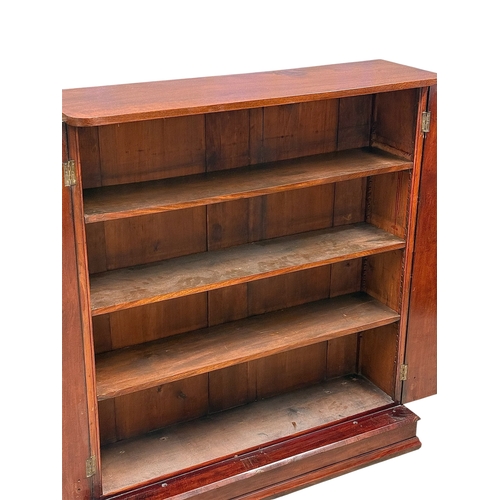 230 - A Victorian Mahogany Two Door Bookcase. 117x36x132cm.