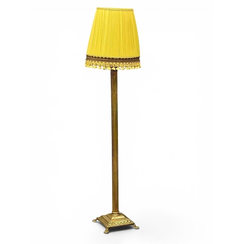 213 - A Brass Standard Lamp. Mid 20th Century. With Corinthian style column and four lion paw feet. 162cm.