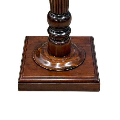 221 - A Regency Style Mahogany Torchiere. 40x101cm.