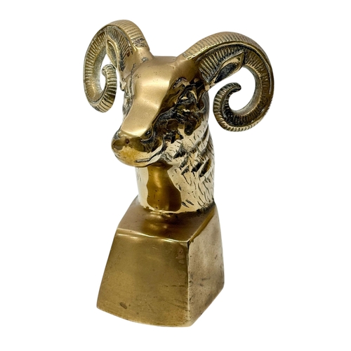 224 - A Pair of Brass Rams Head Bookends. Mid 20th Century. 12x10x18cm.