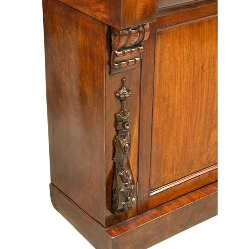 225 - A Victorian Mahogany Side Cabinet. C.1870, Late 19th Century. With Ogee drawer fronts and carved cor... 