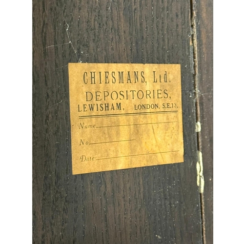 231 - An English Oak Wainscot Style Armchair. C.1880-90, Late 19th Century. With Chiesmans Ltd label.