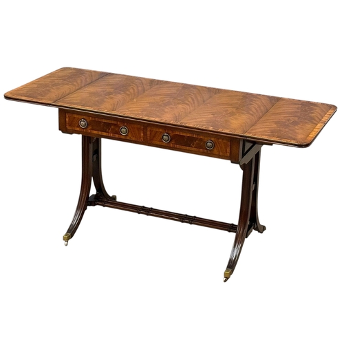 234 - A Quality Regency Style Mahogany Sofa Table with Rosewood Crossbanding. 93x60x73cm. Open 147x60x73cm... 