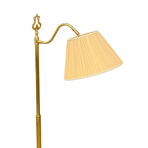 266 - A Brass Floor Reading Lamp. 149cm.