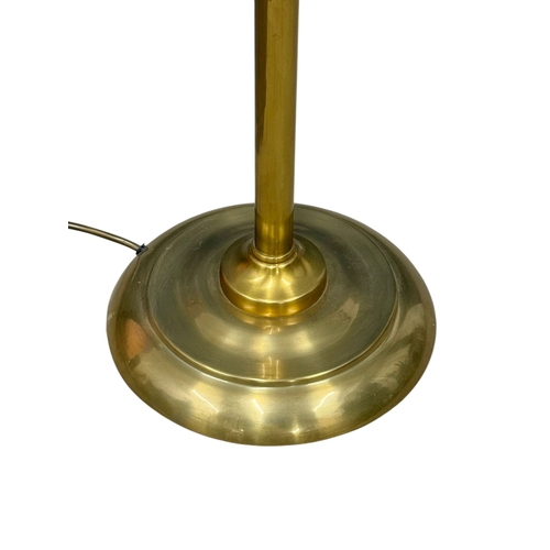 266 - A Brass Floor Reading Lamp. 149cm.