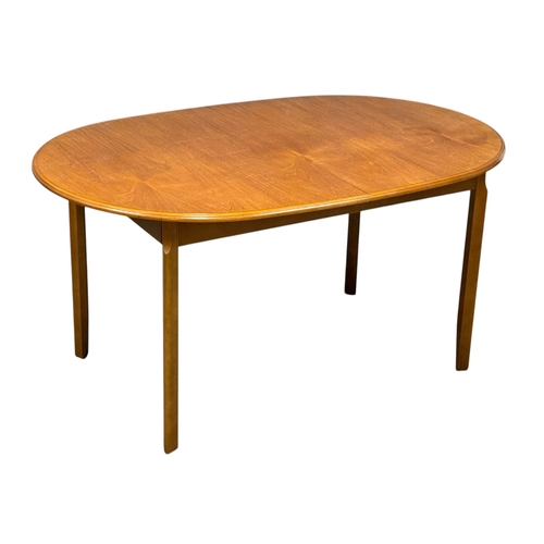 279 - A Teak Extending Dining Table and Six Chairs by Meredew. C.1970. 145x94x74cm. Open 188x94x74cm.