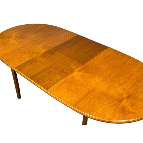 279 - A Teak Extending Dining Table and Six Chairs by Meredew. C.1970. 145x94x74cm. Open 188x94x74cm.