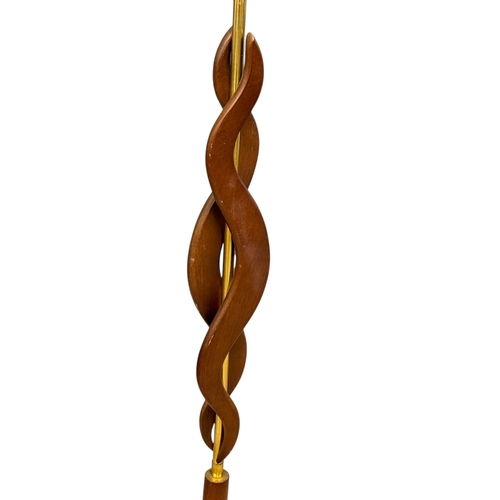 174 - A Teak and Brass Floor Lamp. C.1960. 161cm.