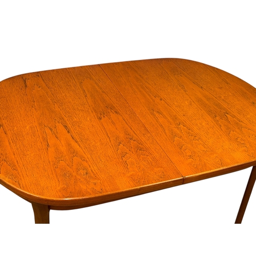 189 - A Teak Dining Table and Six Chairs by Elliots of Newbury. C.1970. 153x107x71.5cm.