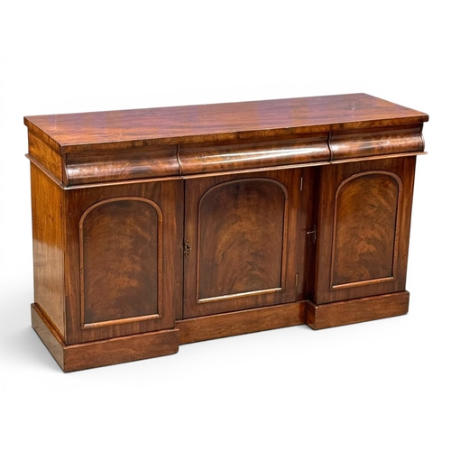 193 - A Victorian Mahogany Sideboard. C.1860-70, 19th Century. Three drawers over three panels doors and f... 