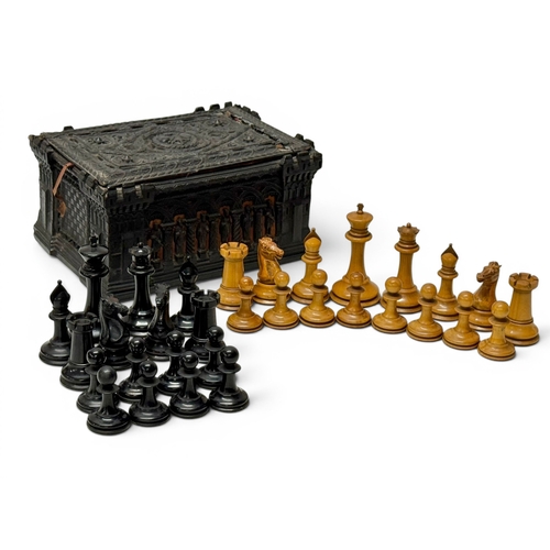 A Jacques of London Staunton Ebony and Boxwood Chess Set. C.1850-65. With original Neo-Gothic Carton Pierre Box. Designed by Joseph L. Williams.